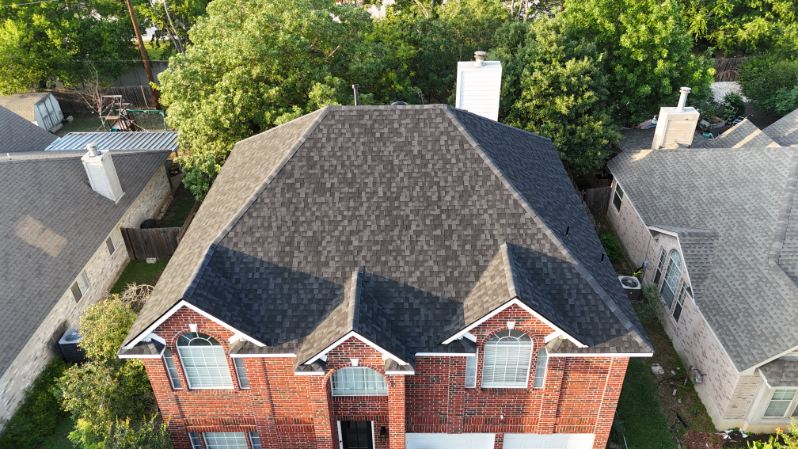 Charcoal shingles on a brick home